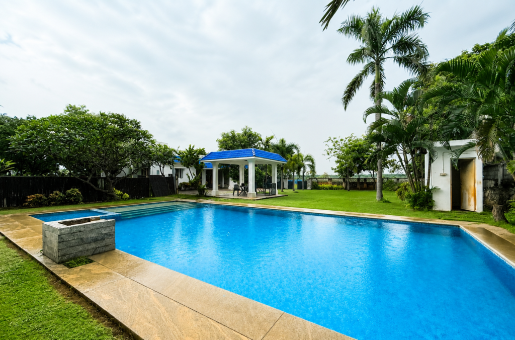 Pool and garden at a luxury resort.